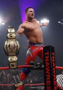 TNA-AJ-Styles-Standing-on-Ropes-with-Belt